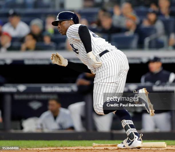Didi Gregorius of the New York Yankees runs up the line with his rbi single in an MLB baseball game against the Minnesota Twins on April 24, 2018 at...