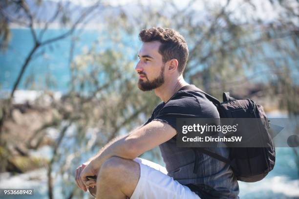 tourist at beach, florianopolis, santa catarina, brazil - beach bag overhead stock pictures, royalty-free photos & images