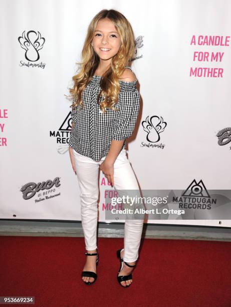 Coco Quinn arrives for a luncheon in honor of Mother's Day for the release of Pamela L. Newton's "A Candle For My Mother" held at Los Angeles Film...