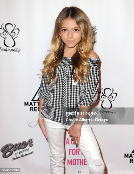 Coco Quinn arrives for a luncheon in honor of Mother's Day for the release of Pamela L. Newton's "A Candle For My Mother" held at Los Angeles Film...