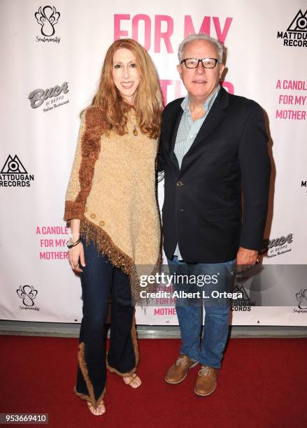 Donna Loyd and Guy Langvardt arrive for a luncheon in honor of Mother's Day for the release of Pamela L. Newton's "A Candle For My Mother" held at...