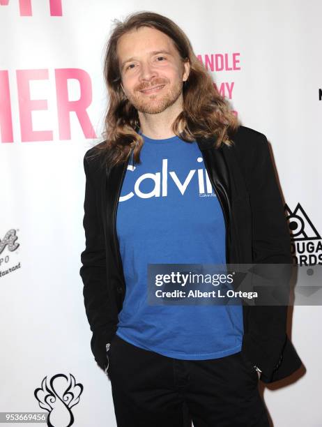 Branden Garrett arrives for a luncheon in honor of Mother's Day for the release of Pamela L. Newton's "A Candle For My Mother" held at Los Angeles...