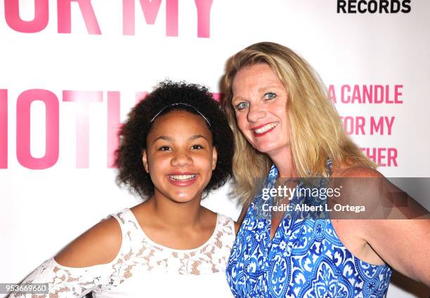 Jillian Estell poses with her mother Kristin Estell at a luncheon in honor of Mother's Day for the release of Pamela L. Newton's "A Candle For My...