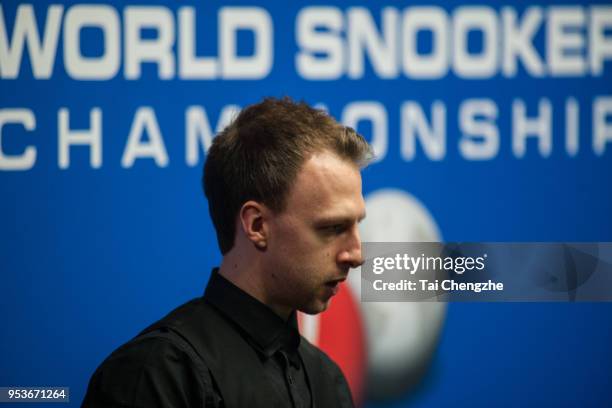 Judd Trump of England reacts in the quarter-final match against John Higgins of Scotland during day eleven of the World Snooker Championship at...