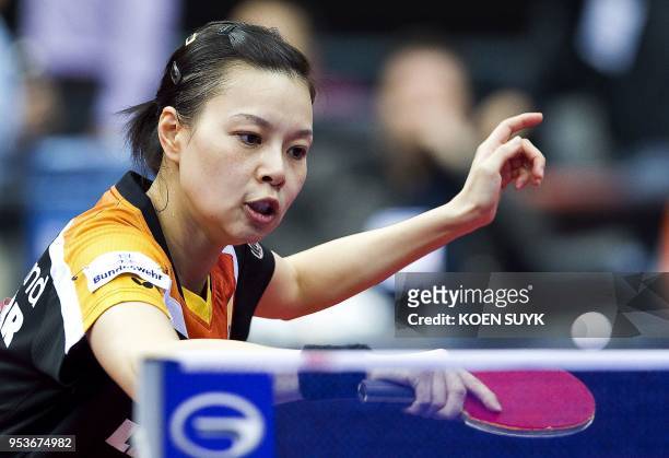 Germany's Wu Jiaduo returns the ball to China's Guo Yue during the women's singles 3rd round match at the World Table Tennis Championships at the...