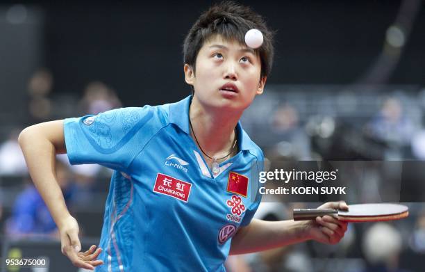 China's Guo Yue returns the ball to Germany's Wu Jiaduo during the women's singles 3rd round match at the World Table Tennis Championships at the...