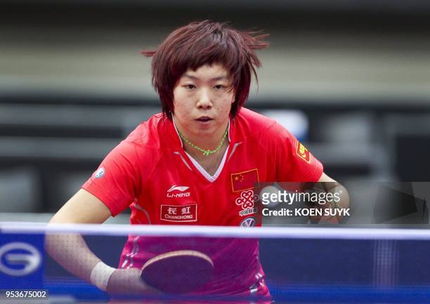 China's Li Xiaoxia returns the ball to Spain's Shen Yanfei during the women's singles 3rd round match at the World Table Tennis Championships at the...