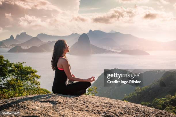 meditating in the nature - niteroi stock pictures, royalty-free photos & images