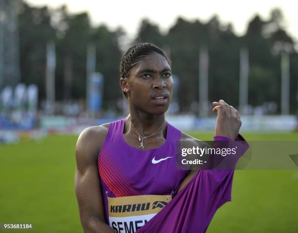 South African athlete Caster Semenya puts a tshirt on in Lappeenranta, Eastern Finland on July 15, 2010 for her first start since the Berlin World...