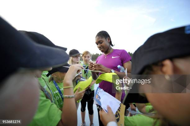 South African athlete Caster Semenya signs autographs to her fans in Lappeenranta, Eastern Finland on July 15, 2010 for her first start since the...