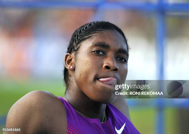 South African athlete Caster Semenya sticks out her tongue as she gets ready prior to compete in Lappeenranta, Eastern Finland on July 15, 2010 for...