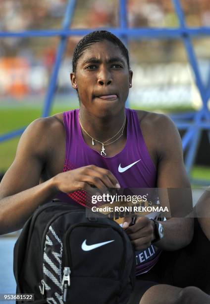 South African athlete Caster Semenya sticks out her tongue as she gets ready prior to compete in Lappeenranta, Eastern Finland on July 15, 2010 for...