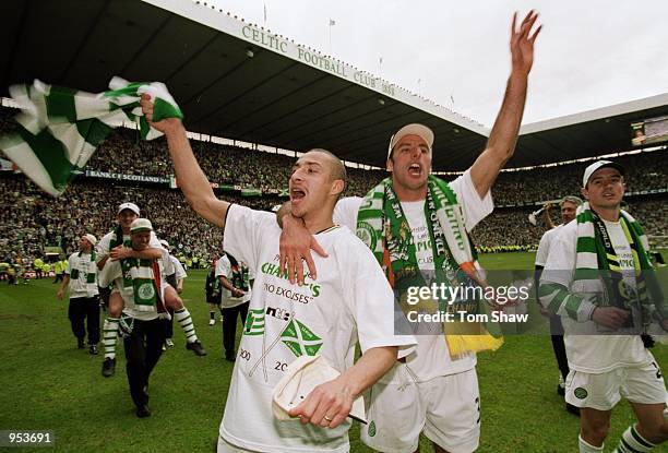 Celtic players Henrik Larsson and Ramon Vega celebrate winning the League Title after the Scottish Premier League game against St Mirren at Celtic...