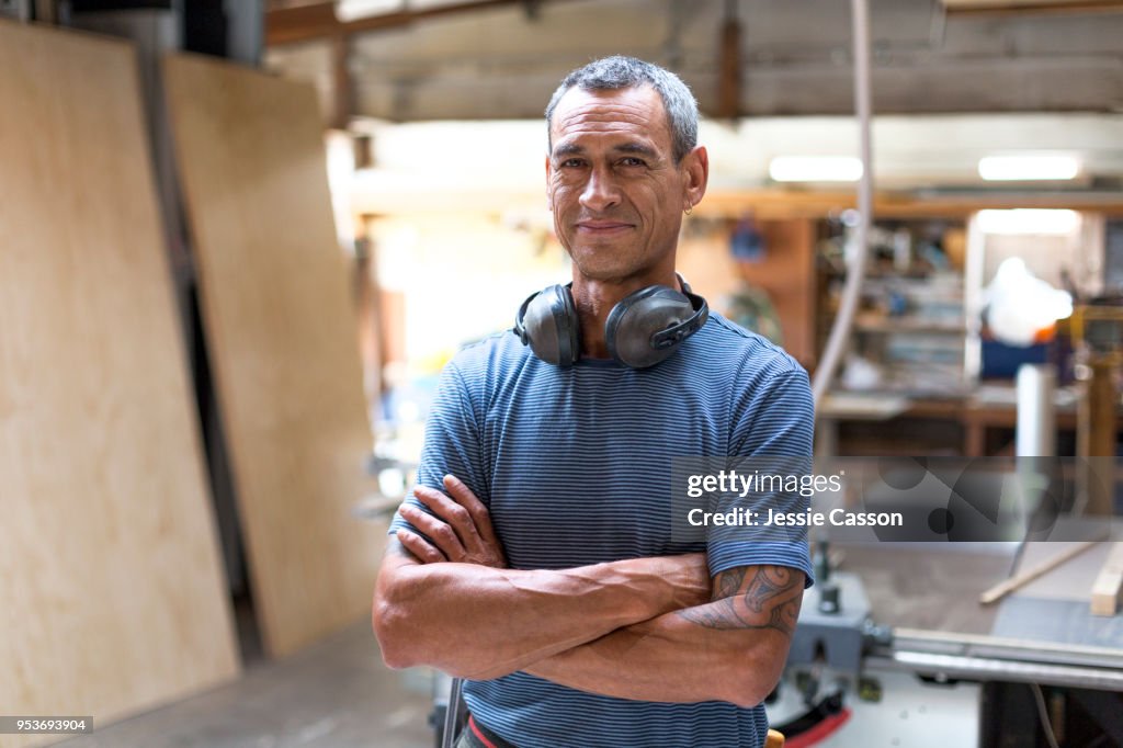 Portrait of a carpenter/builder in his workshop
