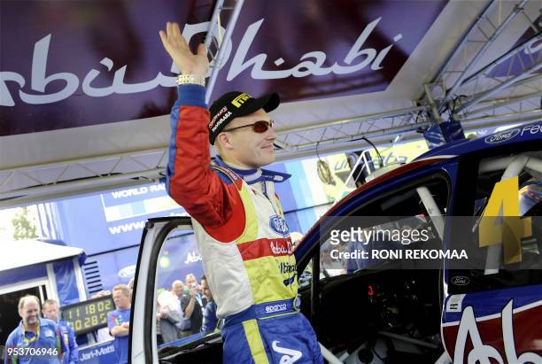 Finland's Jari-Matti Latvala greets fans at the service park in Jyväskylä, Central Finland, on the second day of the WRC Rally Finland on July 31,...