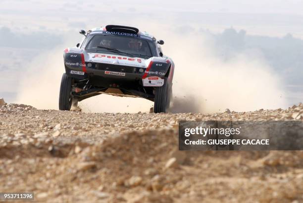 The Volkswagen Buggy Tdi of Belgian pilot Stephane Henrard and his French navigator Antonia De Roissard is seen in action during the second stage of...