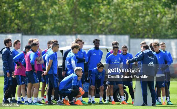 Christian Titz, head coach of Hamburger SV shows this players a tactic board during the training session of Hamburger SV at Volksparkstadion on May...