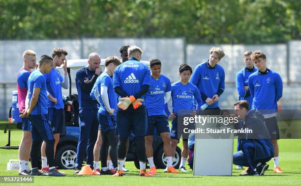 Christian Titz, head coach of Hamburger SV shows this players a tactic board during the training session of Hamburger SV at Volksparkstadion on May...