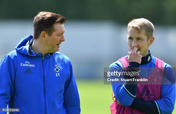 Christian Titz, head coach of Hamburger SV talks with Lewis Holtby during the training session of Hamburger SV at Volksparkstadion on May 2, 2018 in...