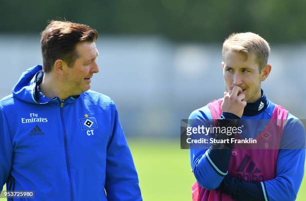 Christian Titz, head coach of Hamburger SV talks with Lewis Holtby during the training session of Hamburger SV at Volksparkstadion on May 2, 2018 in...