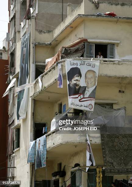 An electoral campaign banner of Lebanese Parliament Speaker Nabih Berri and Imam Mussa al-Sadr, the founder of the Shiite Amal movement who...