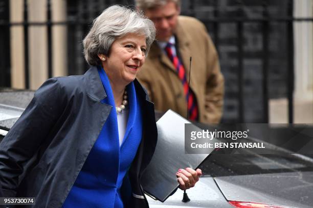 Britain's Prime Minister Theresa May arrives at 10 Downing Street in central London on May 2 after attending the weekly Prime Minister's Questions...