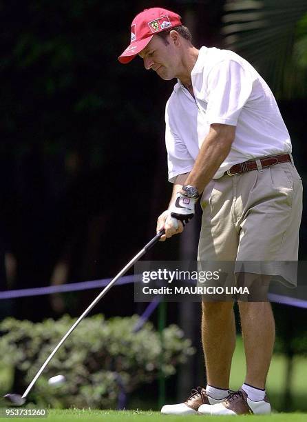 Brazilian F1 driver Rubens Barrichello and teammate of Michael Schumacher of the Ferrari car stable, tries to hit the ball during a tournament at the...