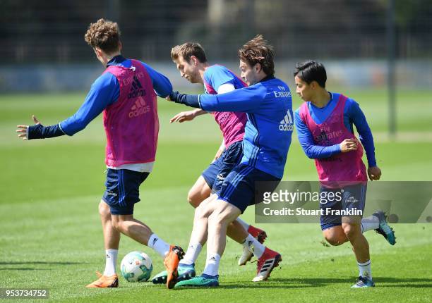 Albin Ekdal IN ACTION WITH Tatsuya Ito and Matti Steinmann during the training session of Hamburger SV at Volksparkstadion on May 2, 2018 in Hamburg,...