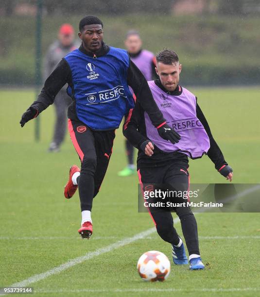 Ainsley Maitland-Niles and Aaron Ramsey of Arsenal during a training session at London Colney on May 2, 2018 in St Albans, England.