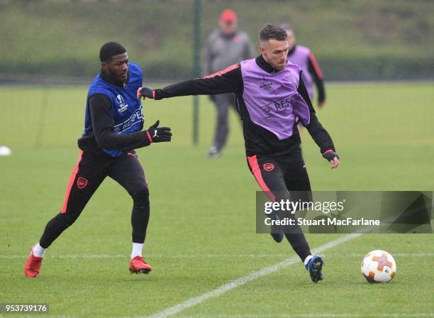 Ainsley Maitland-Niles and Aaron Ramsey of Arsenal during a training session at London Colney on May 2, 2018 in St Albans, England.