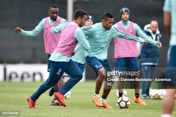 Marco Olivieri and Alex Sandro during the Juventus training session at Juventus Center Vinovo on May 2, 2018 in Vinovo, Italy.