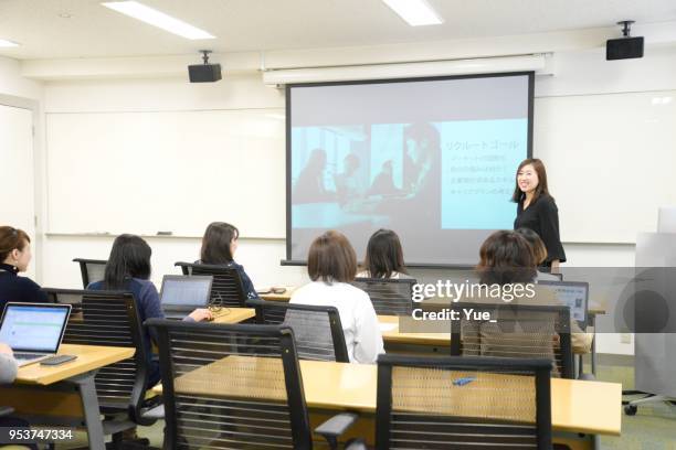 young business woman giving a presentation - japan training session stock pictures, royalty-free photos & images