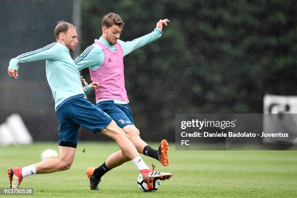 Benedikt Howedes and Daniele Rugani during the Juventus training session at Juventus Center Vinovo on May 2, 2018 in Vinovo, Italy.