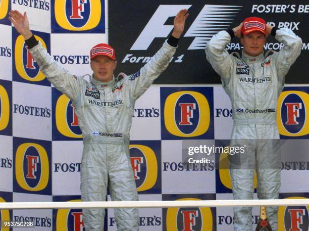 Scottish McLaren-Mercedes driver David Coulthard jubilates after winning the Belgian Formula One Grand Prix ahead of his teammate Finnish Mika...