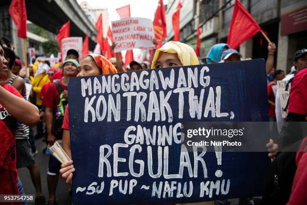 Filipino workers shout slogans during labor day demonstrations outside the presidential palace in Manila, Philippines on May 1, 2018. Thousands of...