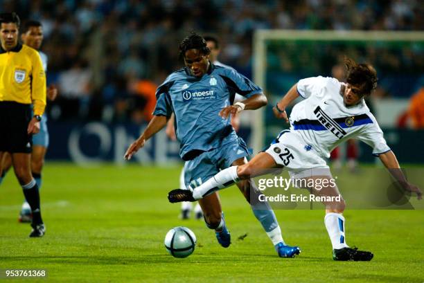 Didier Drogba of Marseille and Matias Almeyda of Inter during the UEFA Cup Quarter Final First Leg match between Marseille and Inter at Velodrome...