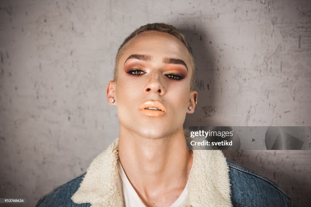 Portrait of young person with ambiguous gaze.