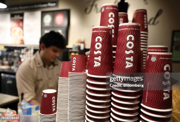 Disposable coffee cups stand next to the counter in a Costa Coffee shop, operated by Whitbread Plc, in London, U.K., on Wednesday, May 2, 2018....