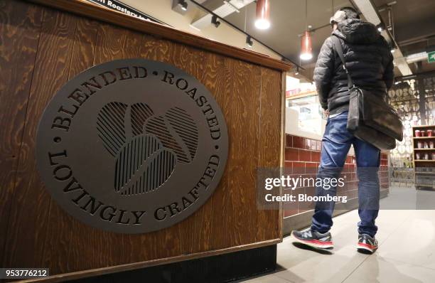 Customer waits to be served inside a Costa Coffee shop, operated by Whitbread Plc, in London, U.K., on Wednesday, May 2, 2018. Whitbread is betting...