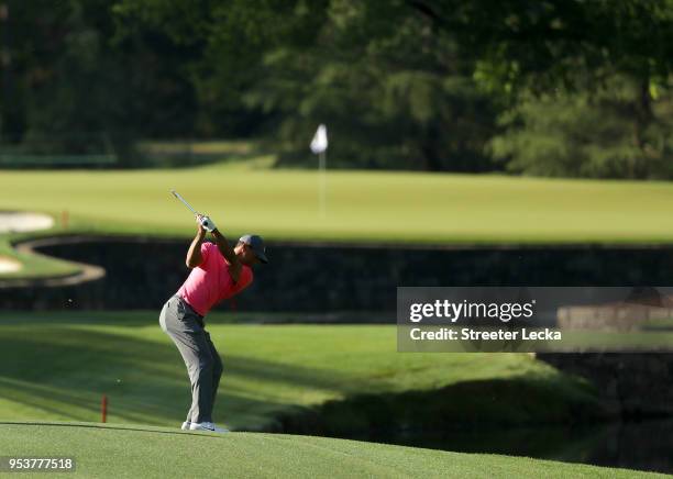 Tiger Woods plays a shot during the Pro-Am for the Wells Fargo Championship at Quail Hollow Club on May 2, 2018 in Charlotte, North Carolina.