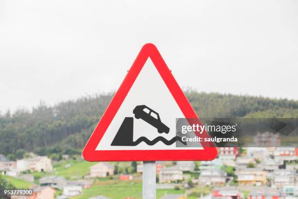 car falling into water warning road sign - eu road sign stock pictures, royalty-free photos & images