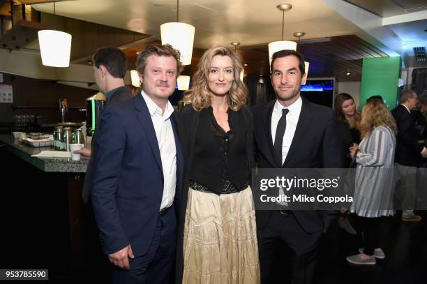 Beau Willimon, Natasha McElhone and Jordan Tappis pose for a photo in the Hulu Upfront 2018 Green Room at The Hulu Theater at Madison Square Garden...