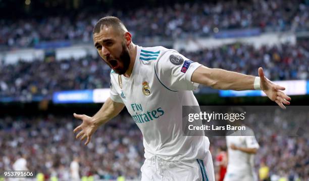 Karim Benzema of Madrid celebrates after scoring his teams first goal during the UEFA Champions League Semi Final Second Leg match between Real...