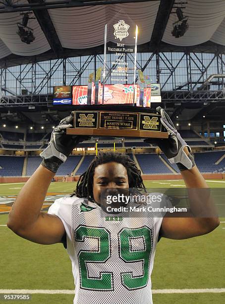 Martin Ward of the Marshall University Thundering Herd poses for a photo with his Most Valuable Player of the game trophy after the victory against...