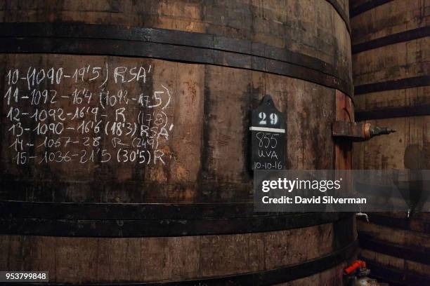 Large wooden tanks are used to process the grapes in the fermentation hall at Bodegas López de Heredia Viña Tondonia winery during the harvest on...