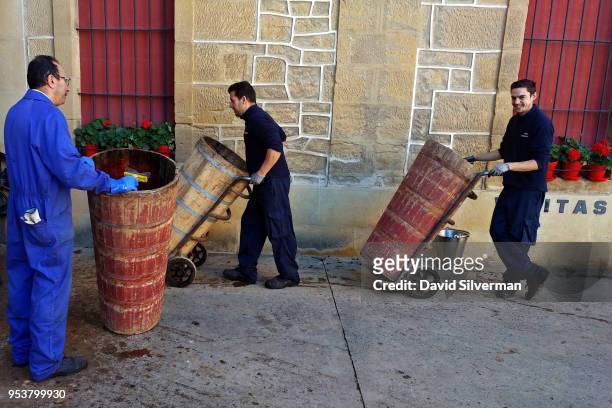 Workers bring barrels of hand-picked grapes to Bodegas López de Heredia Viña Tondonia winery during the harvest on October 15, 2016 in the city of...