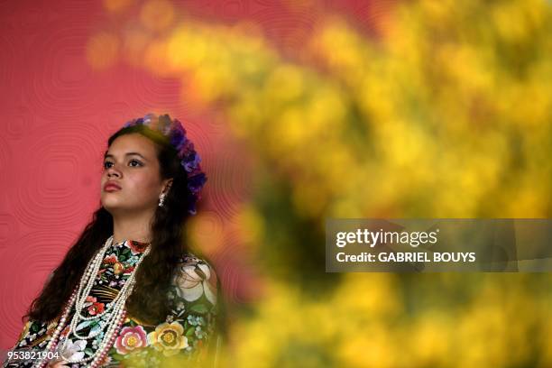 Andrea Ramos Diaz takes part in the "Las Mayas" festival in Colmenar Viejo near Madrid on May 2, 2018. - The Mayas, young girls aged between 7 and...