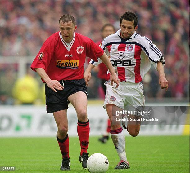 Pawel Kryszalowicz of Eintracht Frankfurt takes the ball past Hasan Salihamidzic of Bayern Munich during the German Bundesliga match played at the...