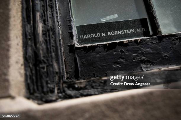 Nameplate sits in the window of the office of Dr. Harold Bornstein, who was previously President Donald Trump's longtime personal physician, May 2,...