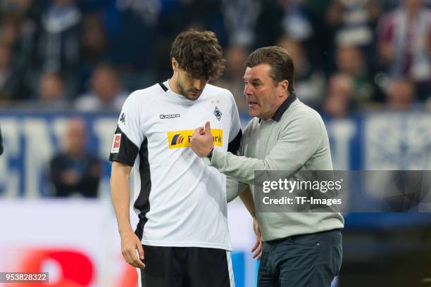 Tobias Strobl of Moenchengladbach speaks with Head coach Dieter Hecking of Moenchengladbach during the Bundesliga match between FC Schalke 04 and...